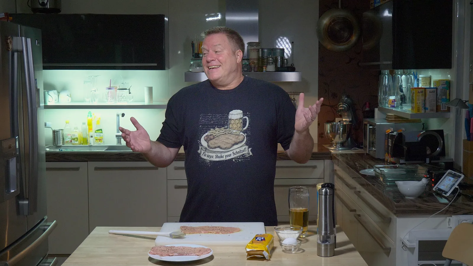 Flo in his kitchen, wide shot