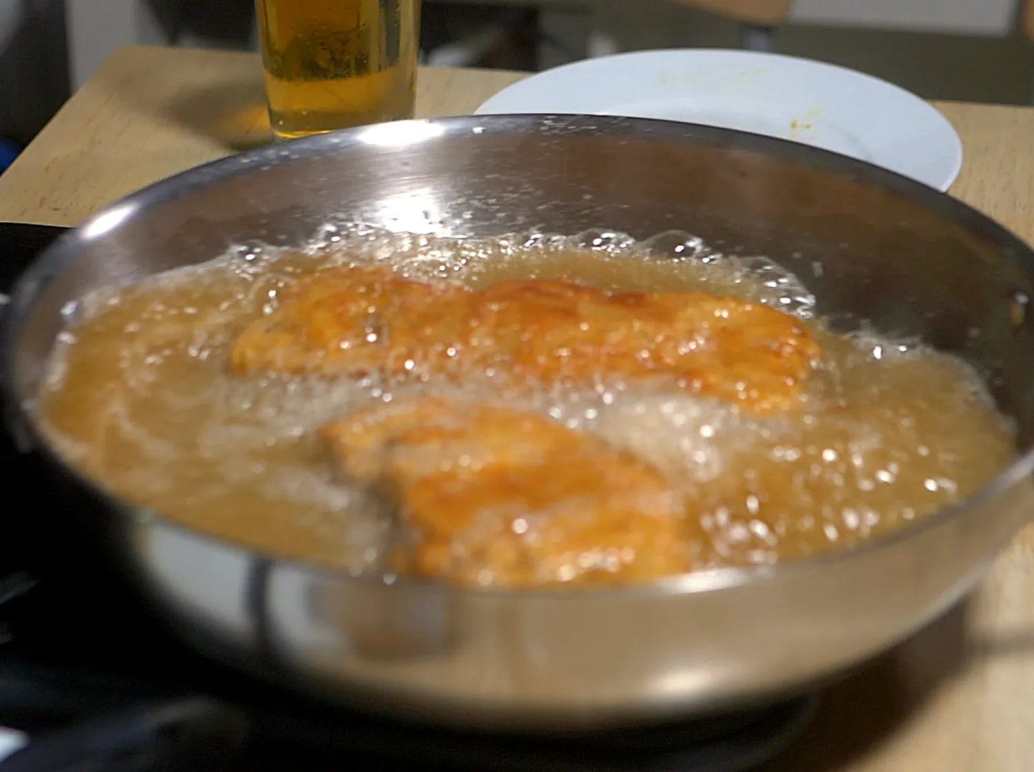 Cracker Schnitzel frying in a pan